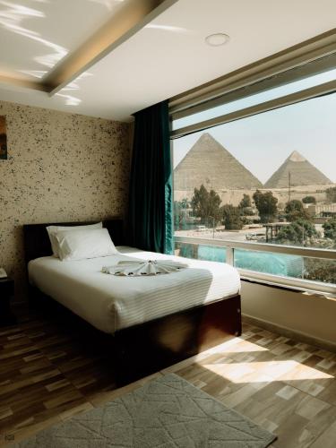 Turquoise Pyramids & Grand Egyptian museum view Hotel